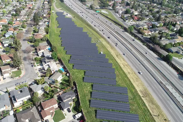 Solar panels near homes and freeway