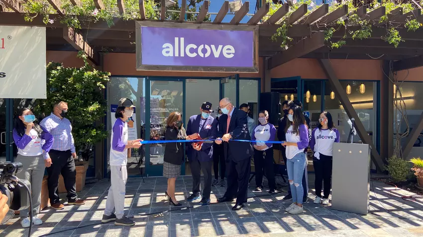 Supervisor Simitian surrounded by teens and young adults at a ribbon cutting ceremony for a new Allcove facility.